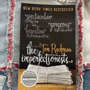 The Imperfectionists by Tom Rachman - Black & White Paperback fiction book